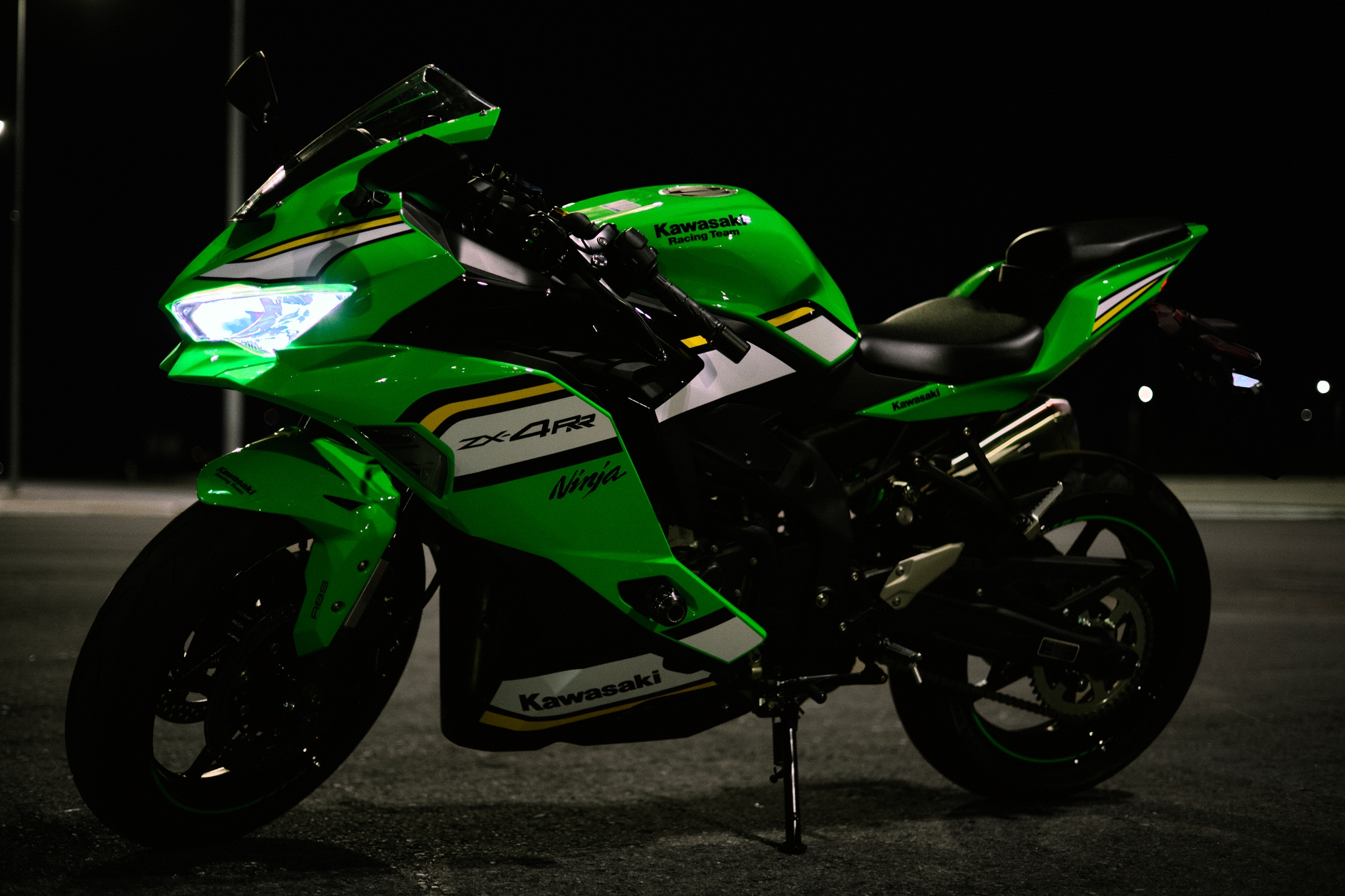 Green ninja motorcycle illuminated at night